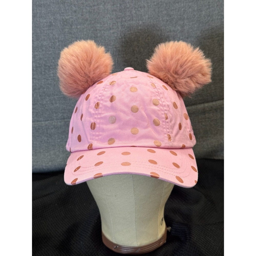 Pink‎ polka-dot cap topped with two fluffy faux fur pom poms